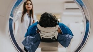 Radiologist talking a patient through an MRI